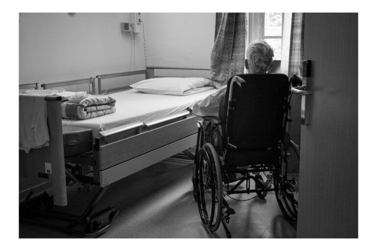 a person in a wheelchair in a room